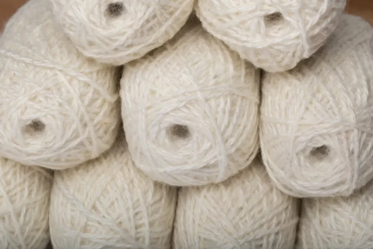 Close-up of soft white balls of yarn